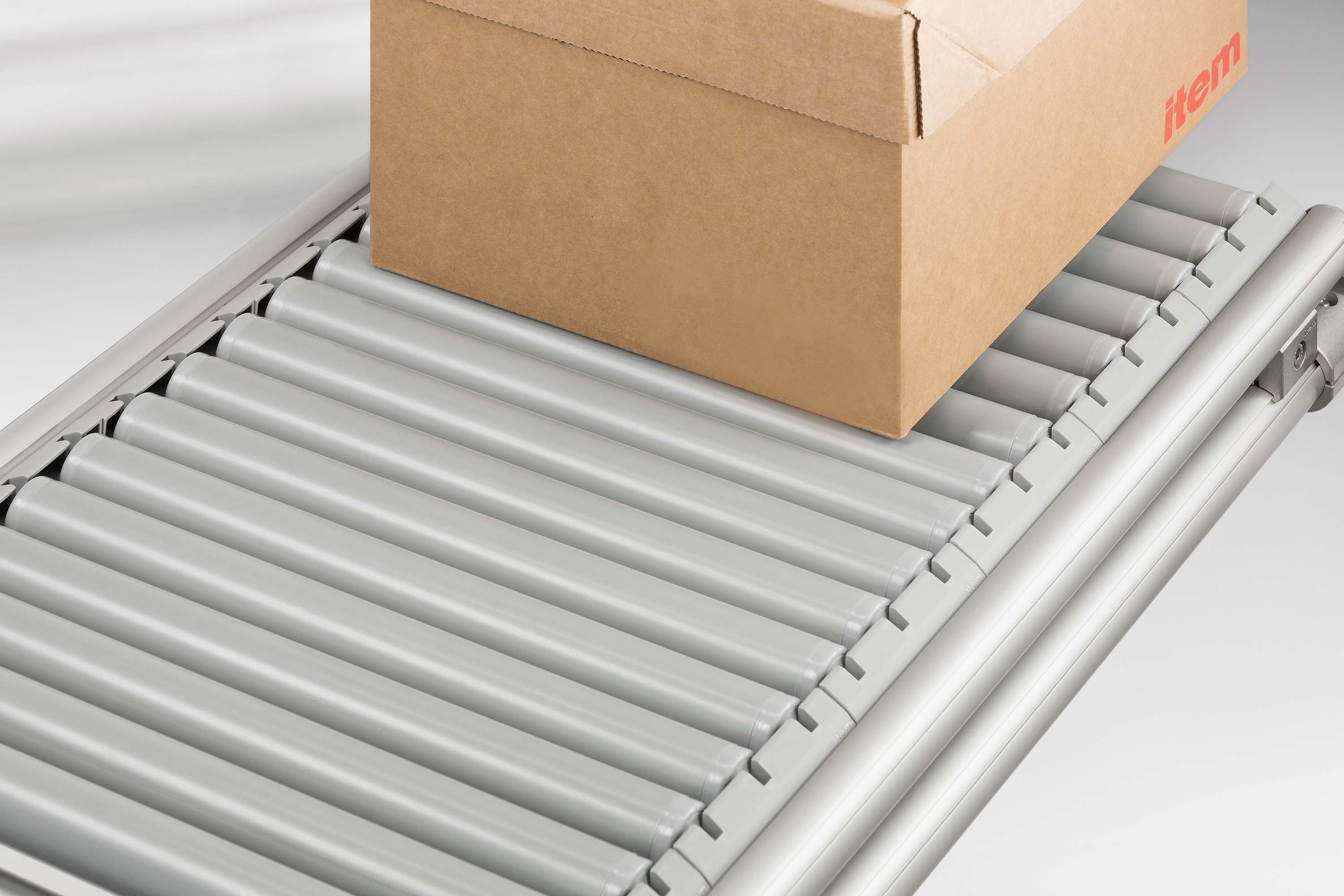 Roller conveyors and slide strips
